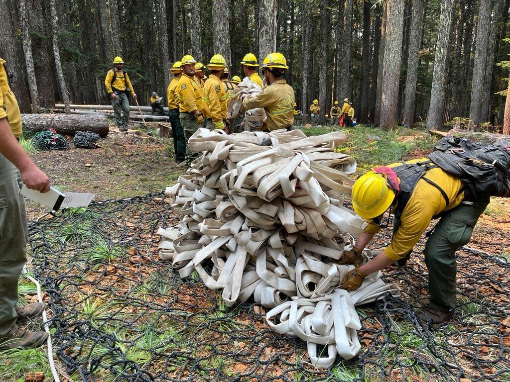 Crew packaging a helicopter sling load