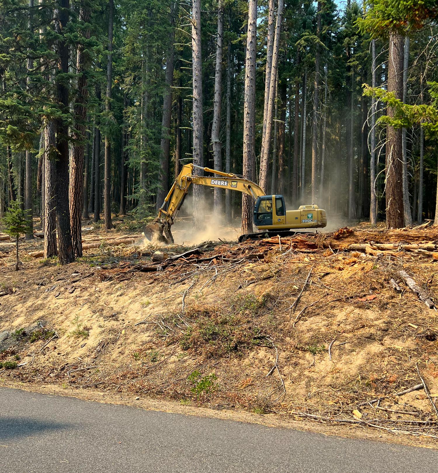 Excavator Working on a Shaded Fuel Break // Red Fire