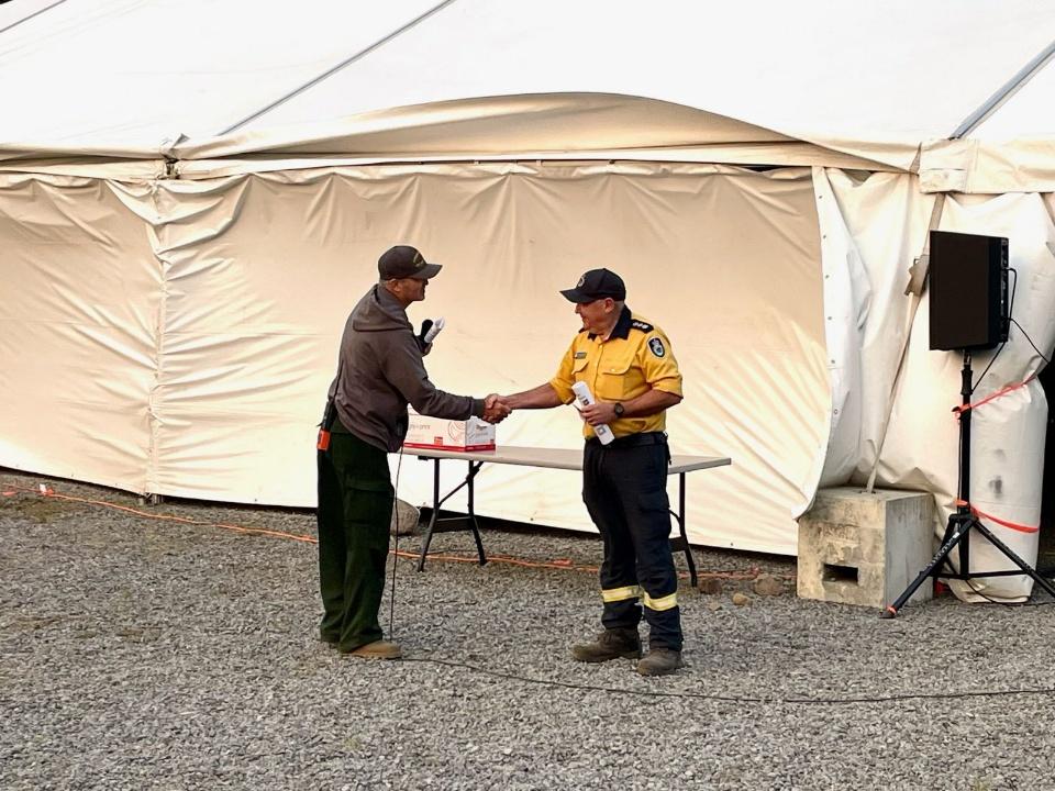 Image of two men shaking hands.