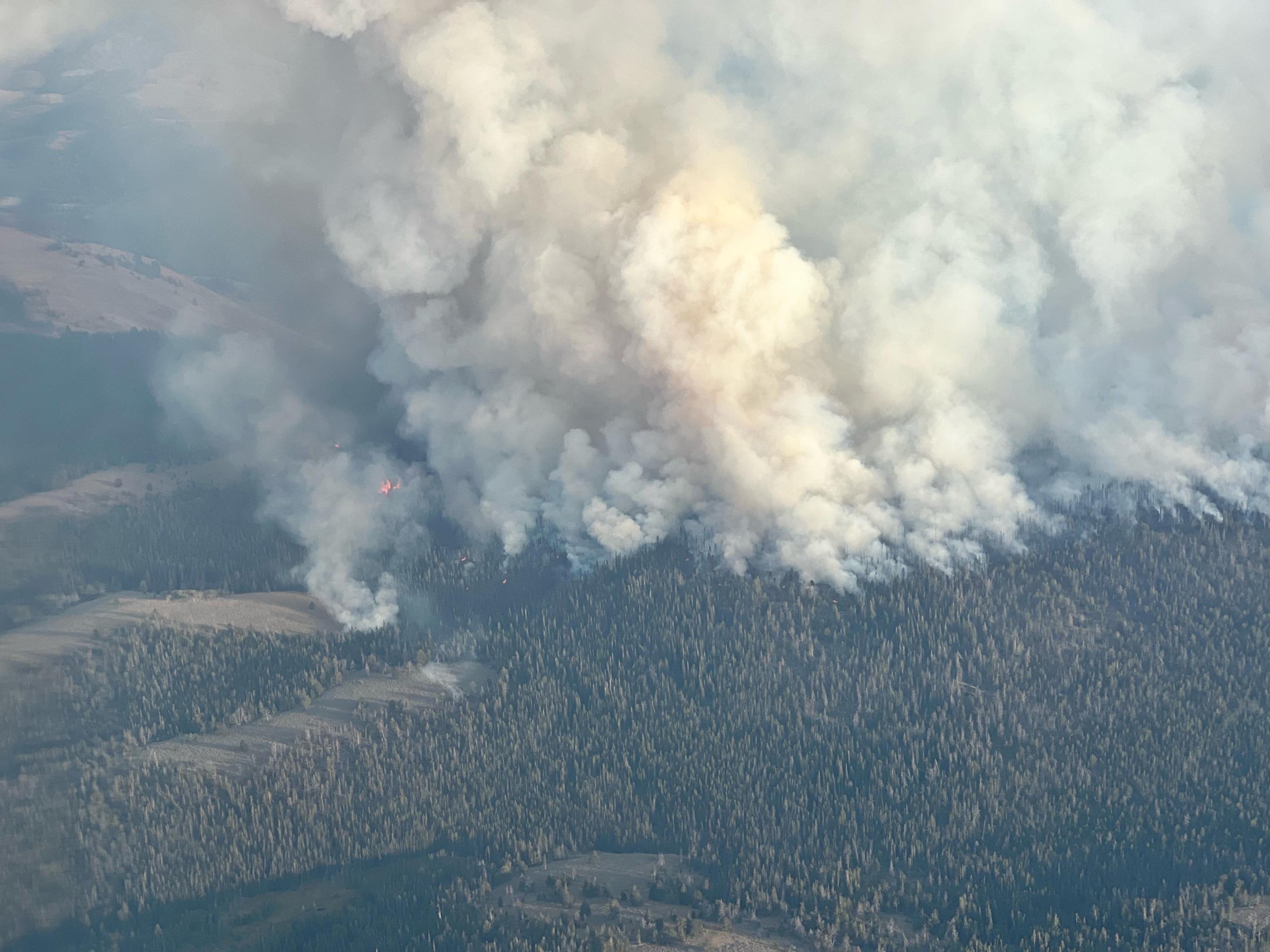 Smoke from the Frog Fire is rising above the mountains