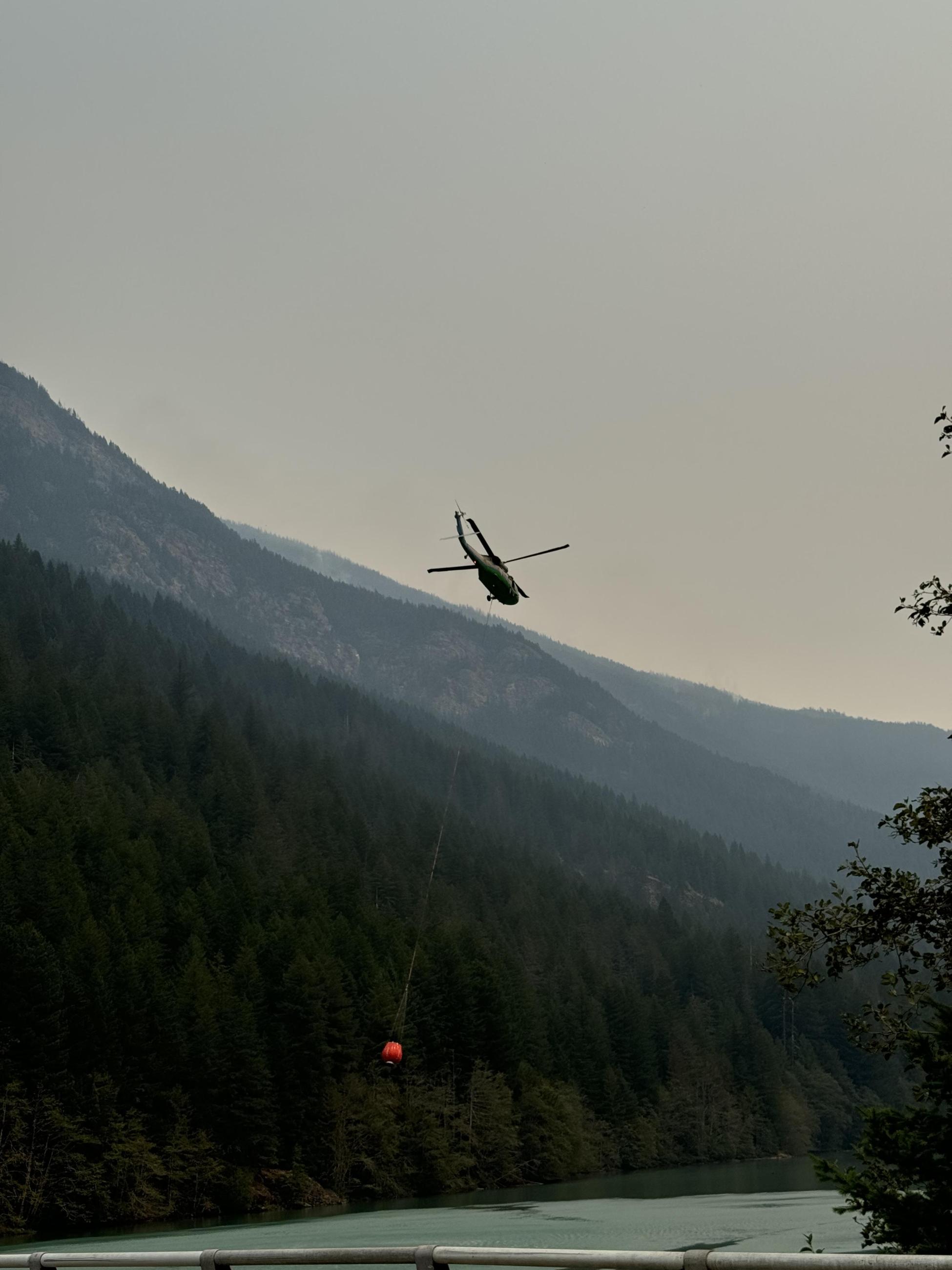 Helicopter retrieves water from Diablo Lake 