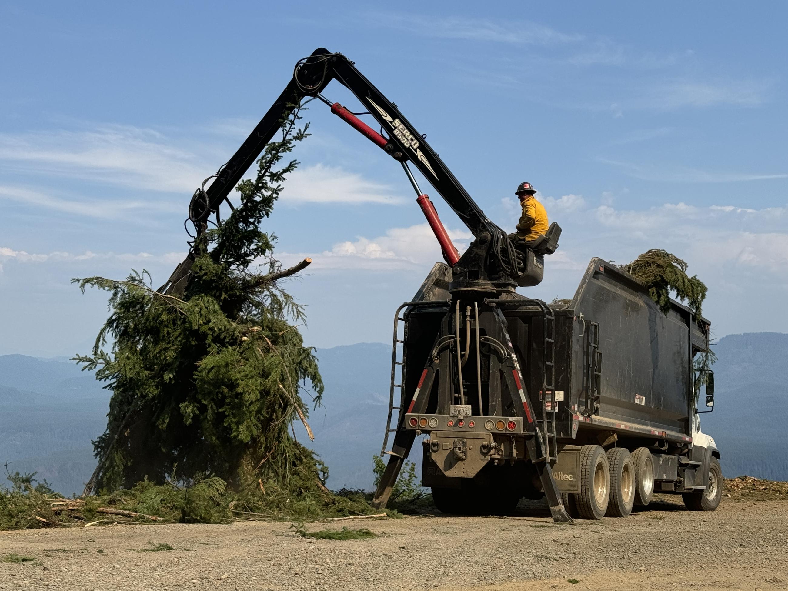 Operator Loading Wood // Chalk Fire September 4th by Jacob Welsh