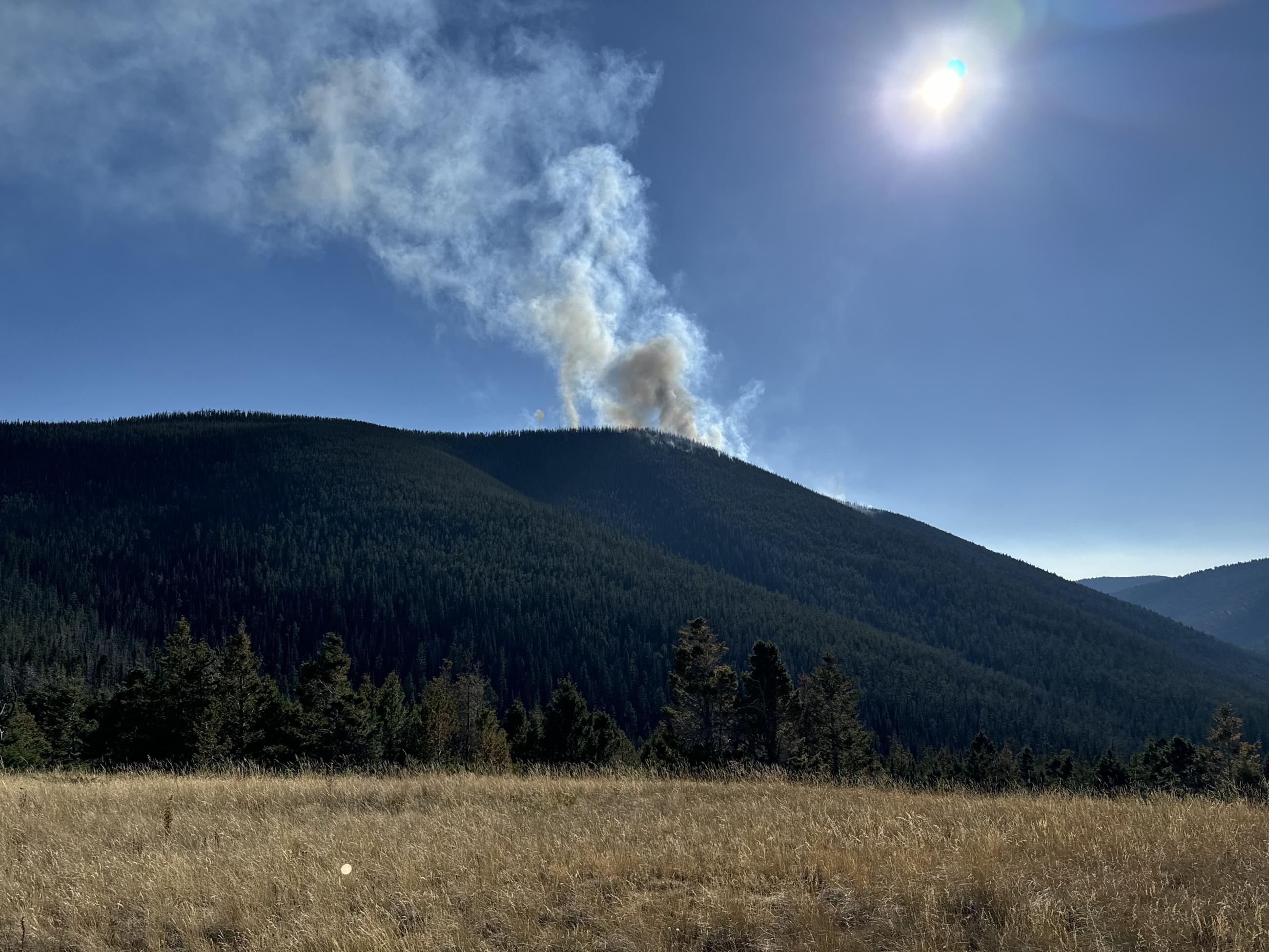 Column of smoke rises from the Marsh Creek Fire on Sept 5