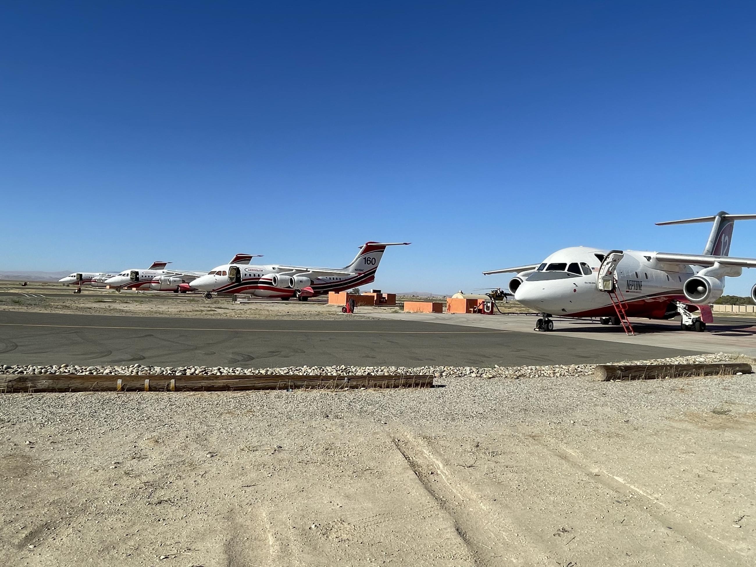 Photo of fixed-wing airplanes at an airport.