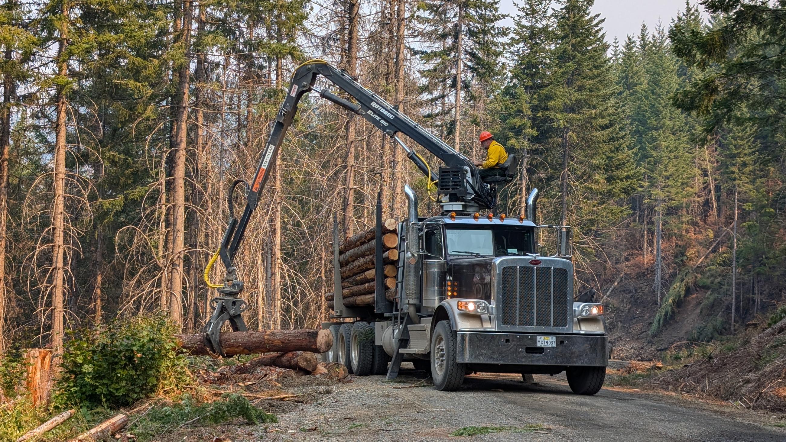 Heavy equipment operator captured by Cody Mosley // Chalk Fire