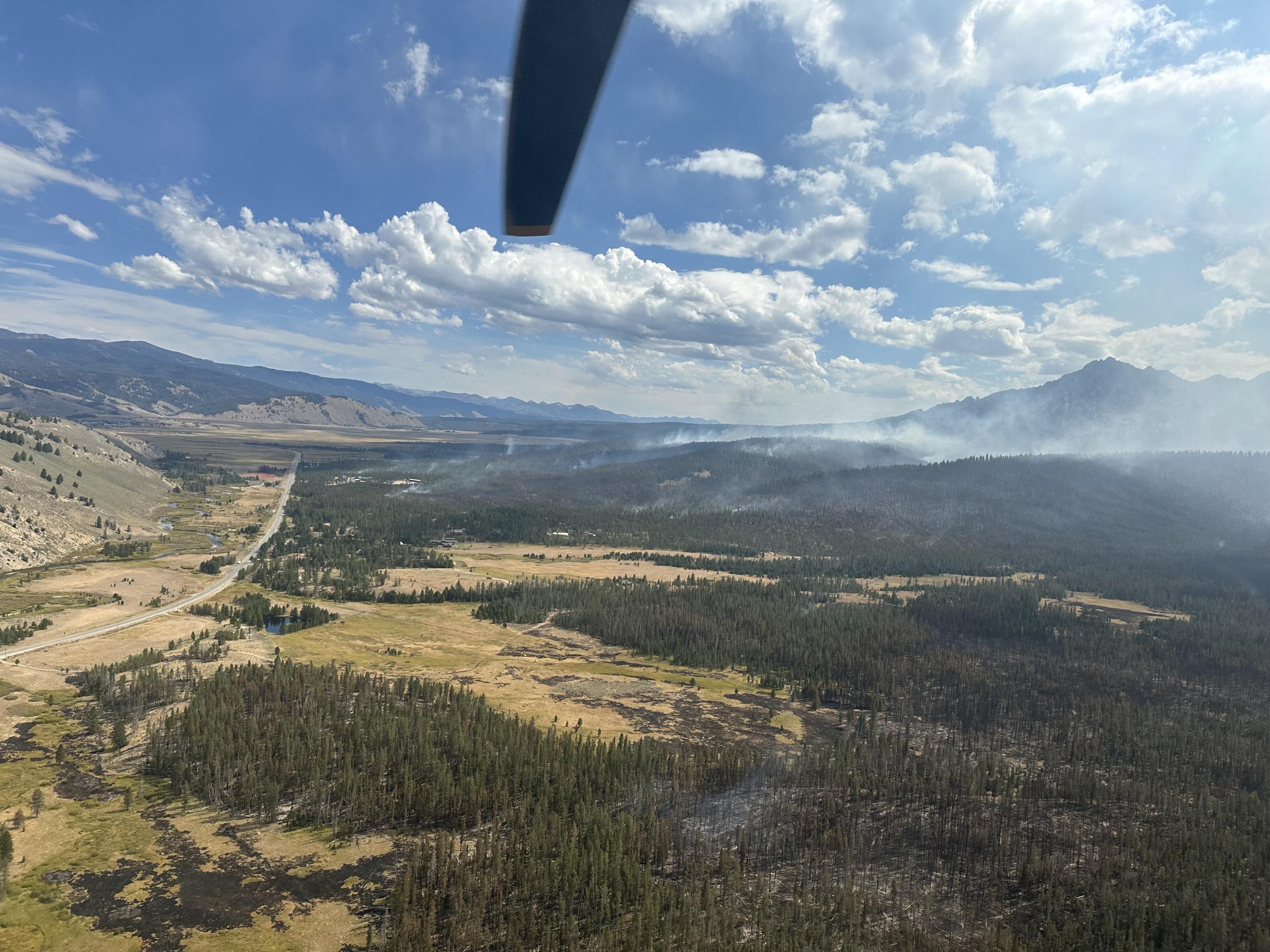 Like smoke rises from Wapiti Fire During Reconnaissance Flight, Monday, September 2