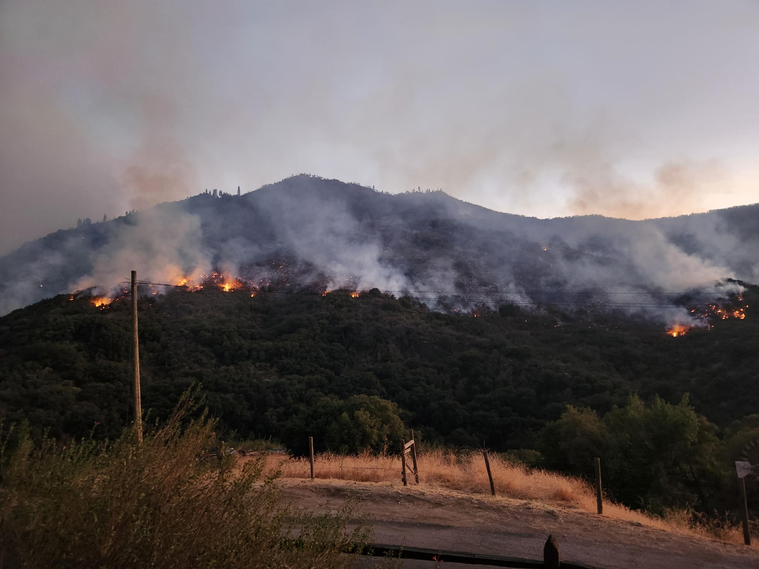 Flames and smoke at mid slope 