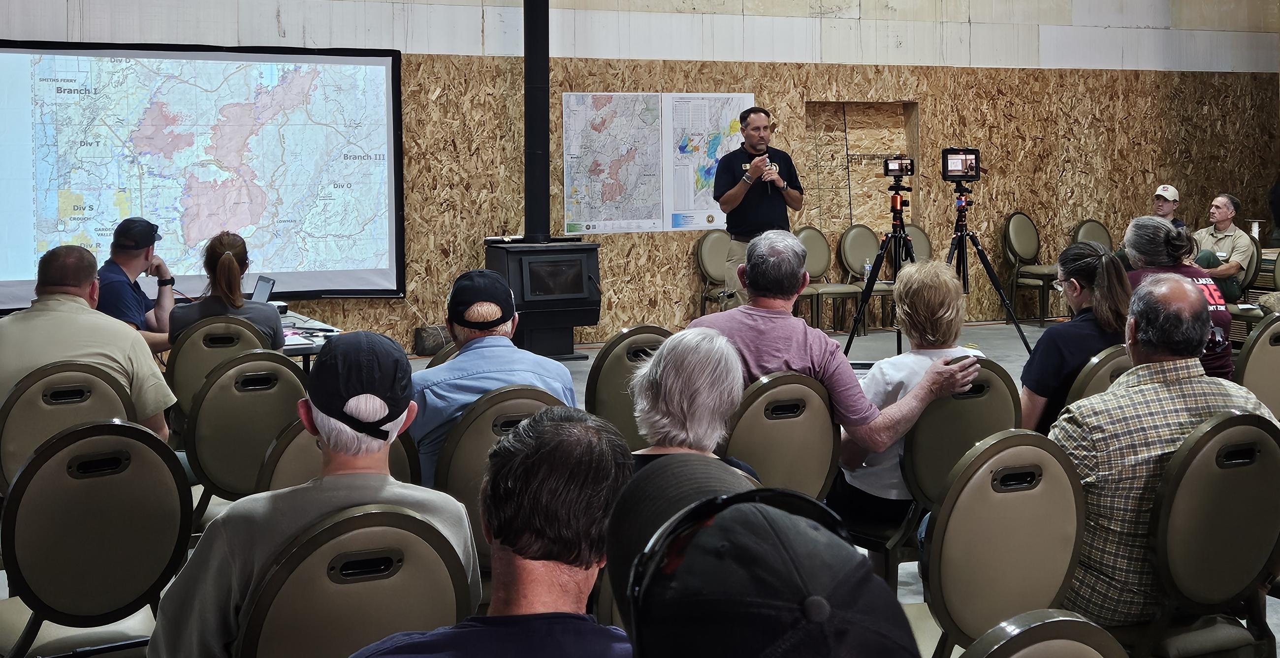 Incident Commander Trent Ingram answers questions at the community meeting. 