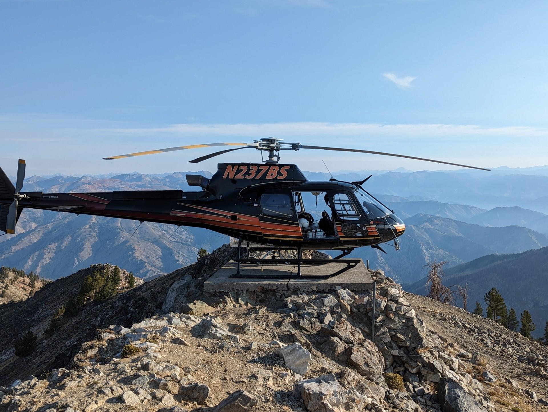 Helicopter perched on a landing pad on the Chimney Fire