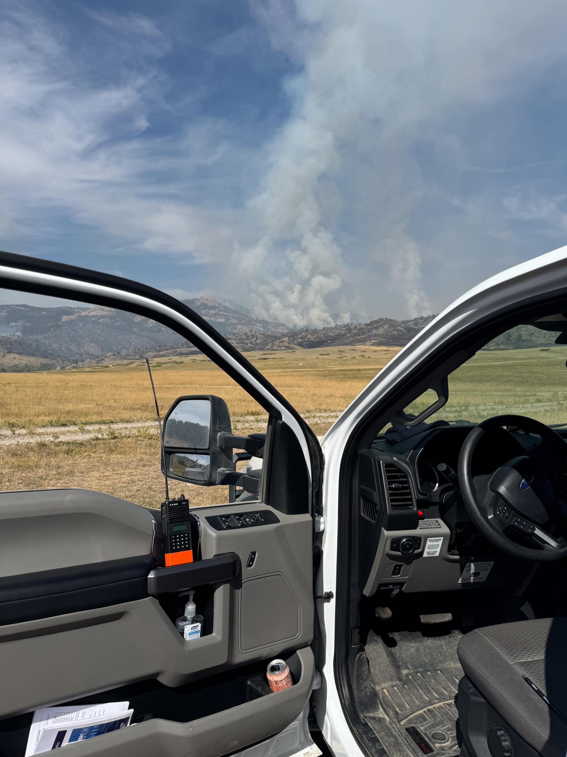 La Bonte Fire smoke column, looking through vehicle