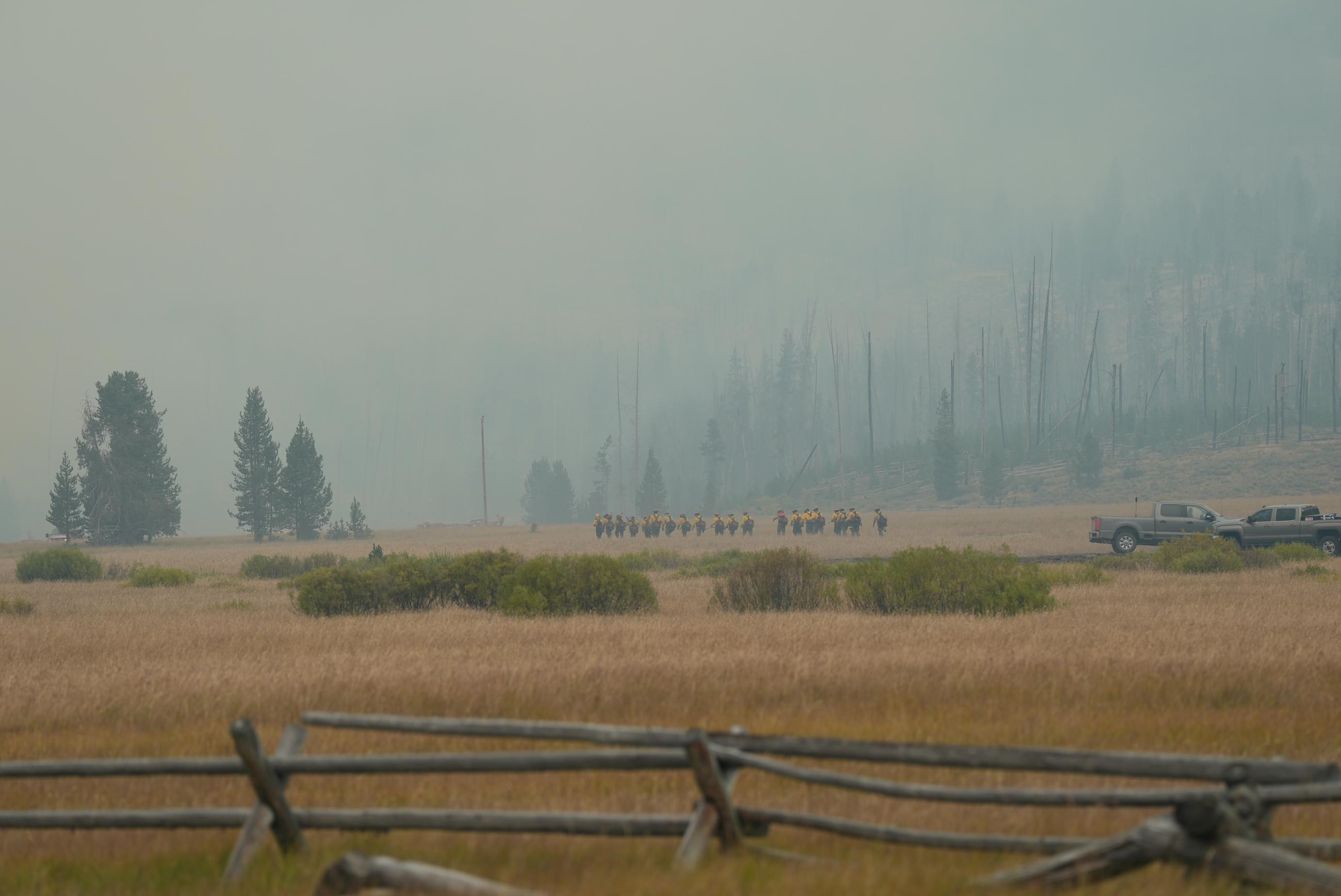 photo showing crew hiking into spot fire