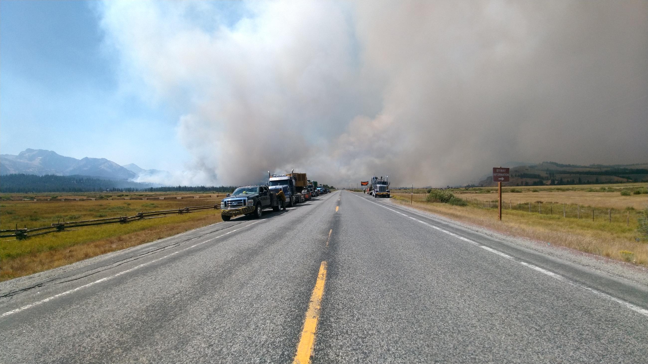 Fire and smoke on sides of Hwy 21 with vehicles, August 27