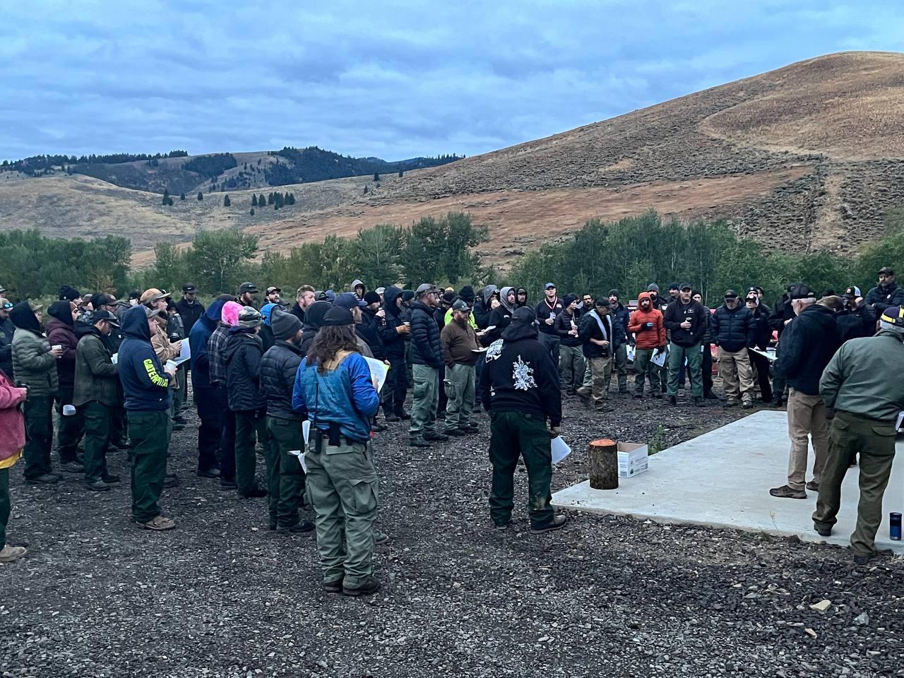 Photo Crews gathered around the stage for Morning Briefing at the Oyler Camp