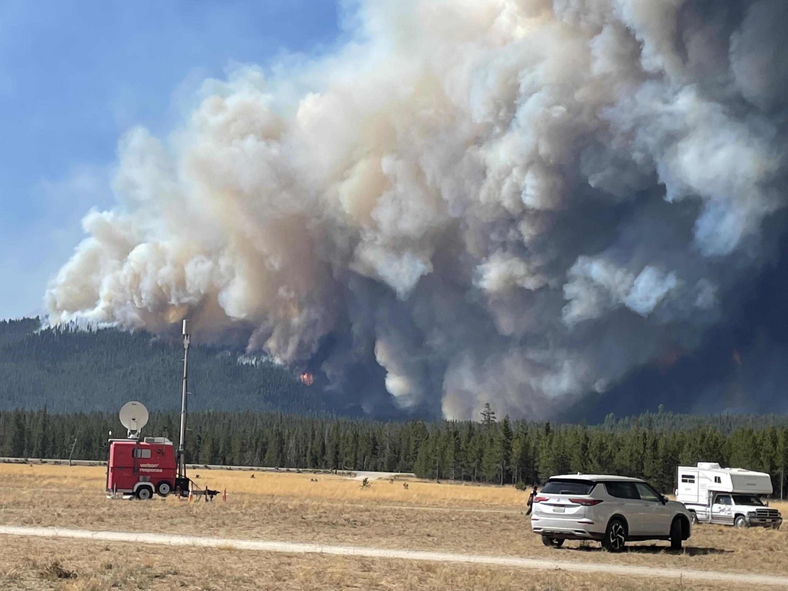 large dark smoke column viewed from Incident command post, aug 23