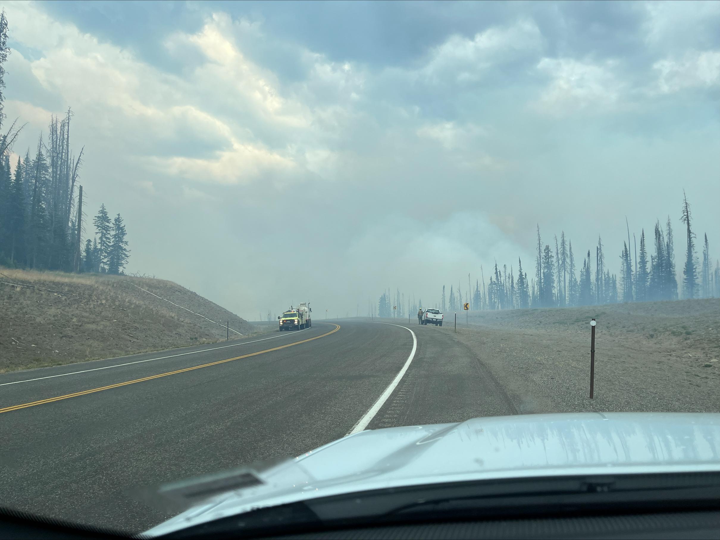 Wildfire crews work to keep the fire west of HWY 26