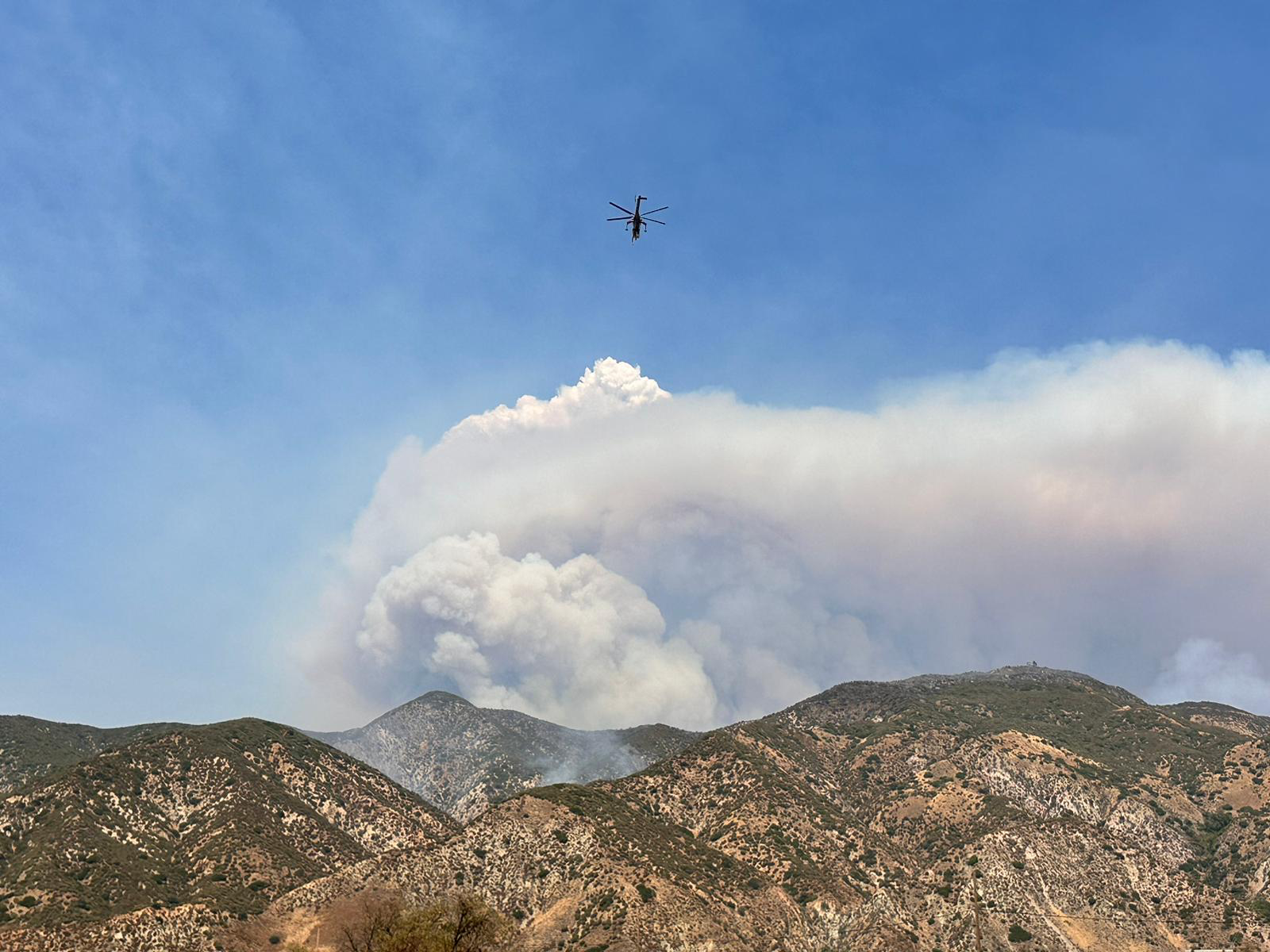 image of smoke rising from the mountains.