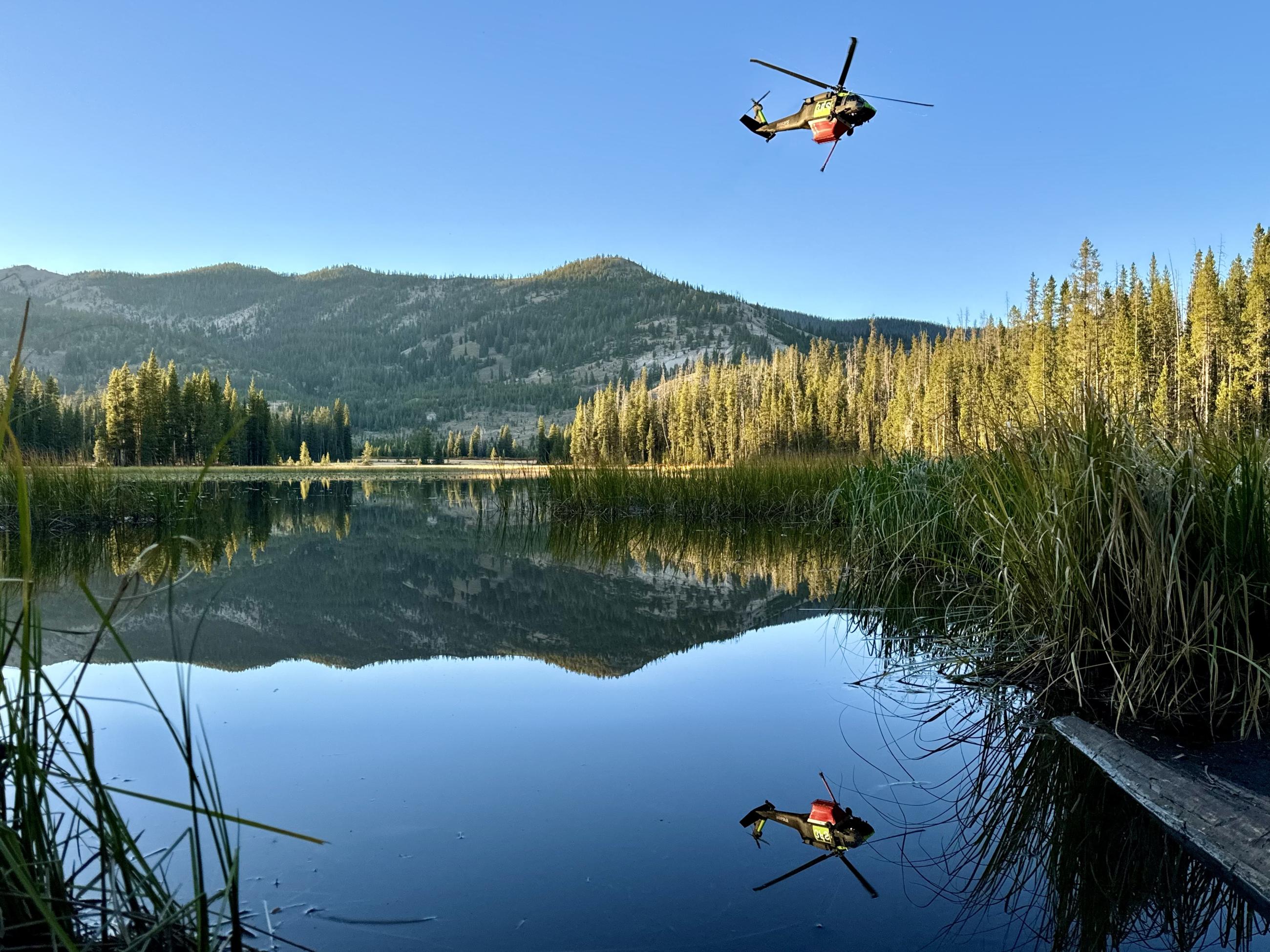 Helicopter flies over a pond, 9/26/24