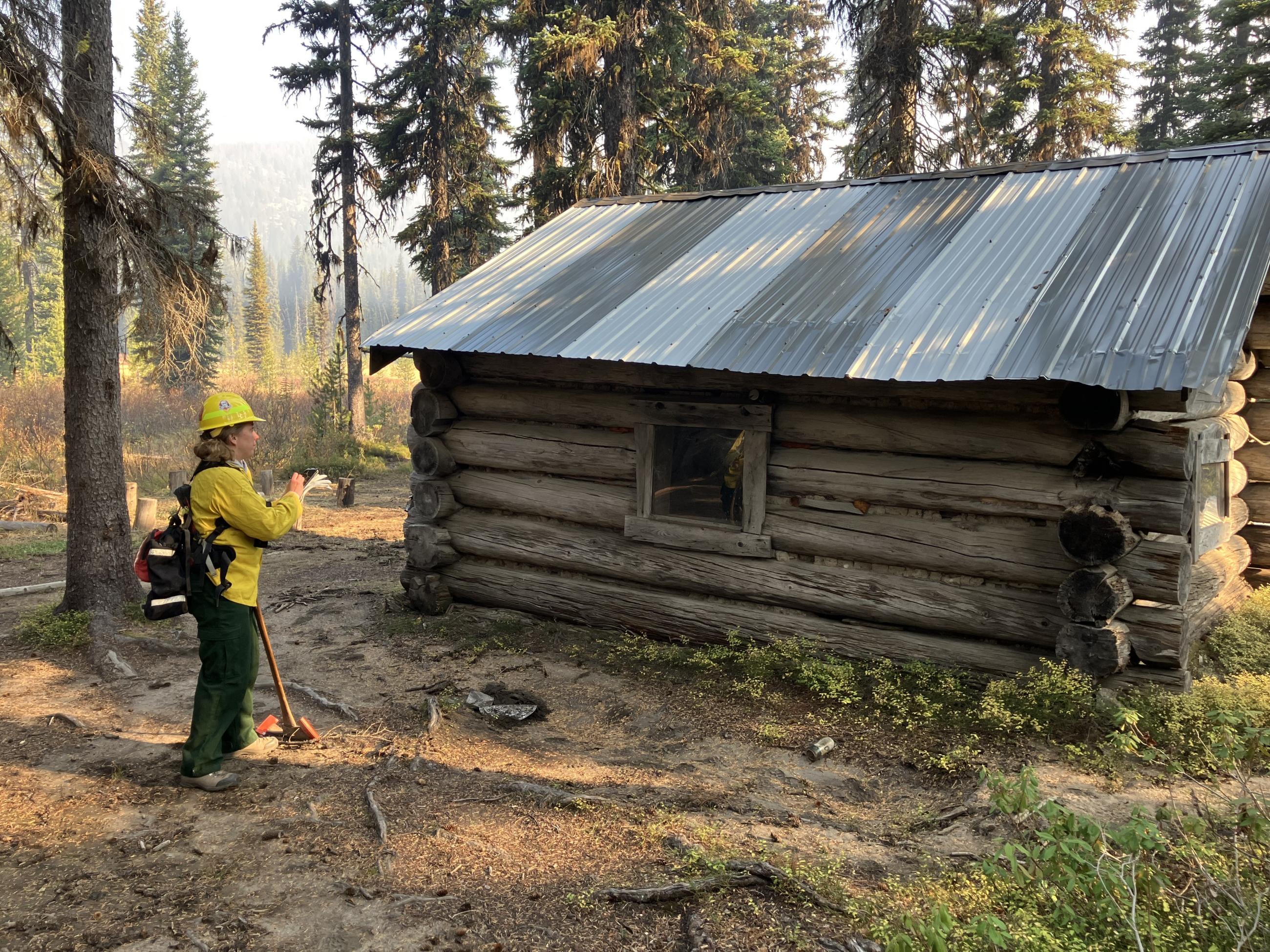 Image showing BAER Archeologist Sarah Herrea Assessing Stoney Meadows Historic Warming Hut within the Snag Burn Area