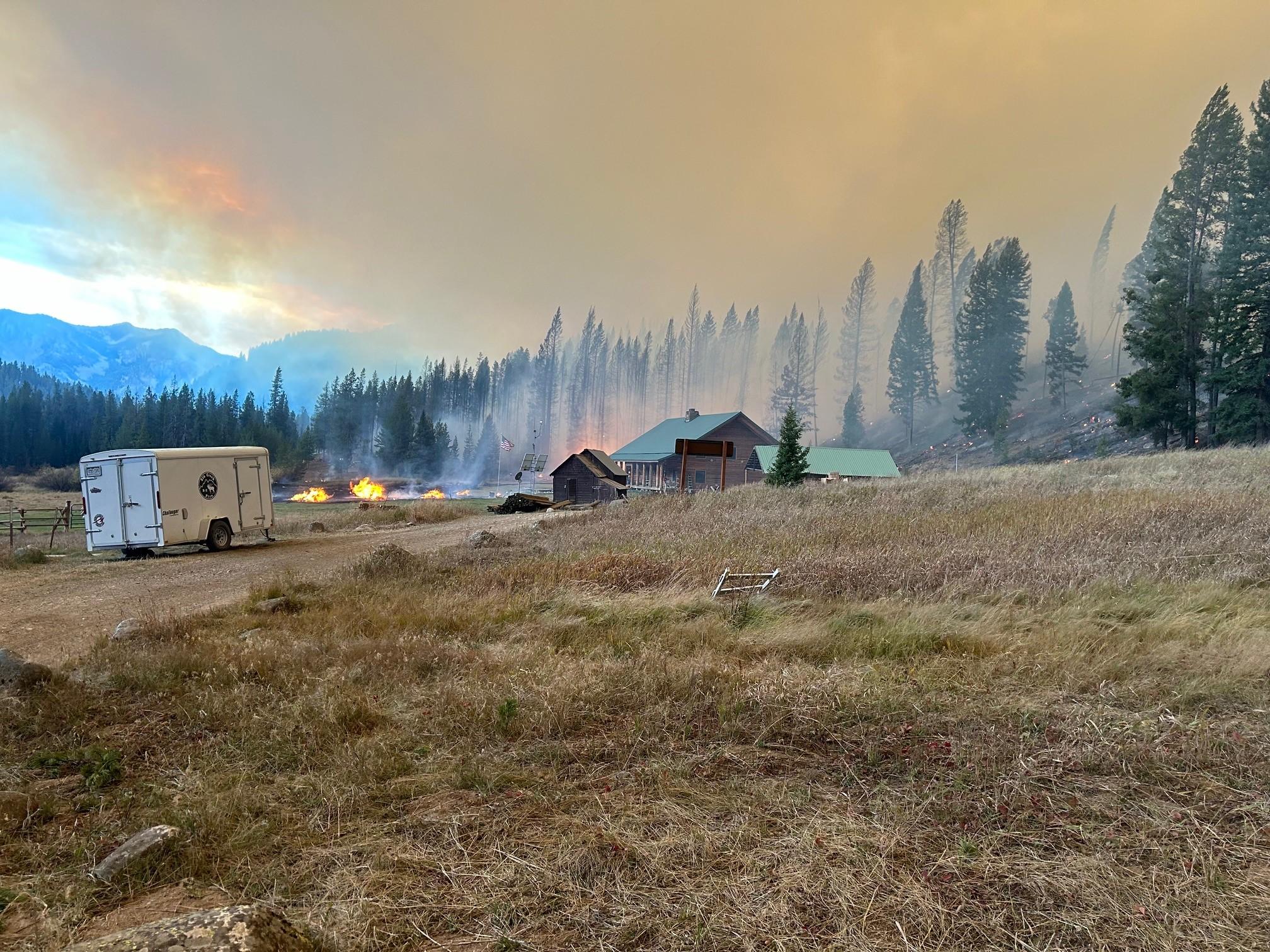 Photo shows the Big Creek Lodge in the distance with smoke.