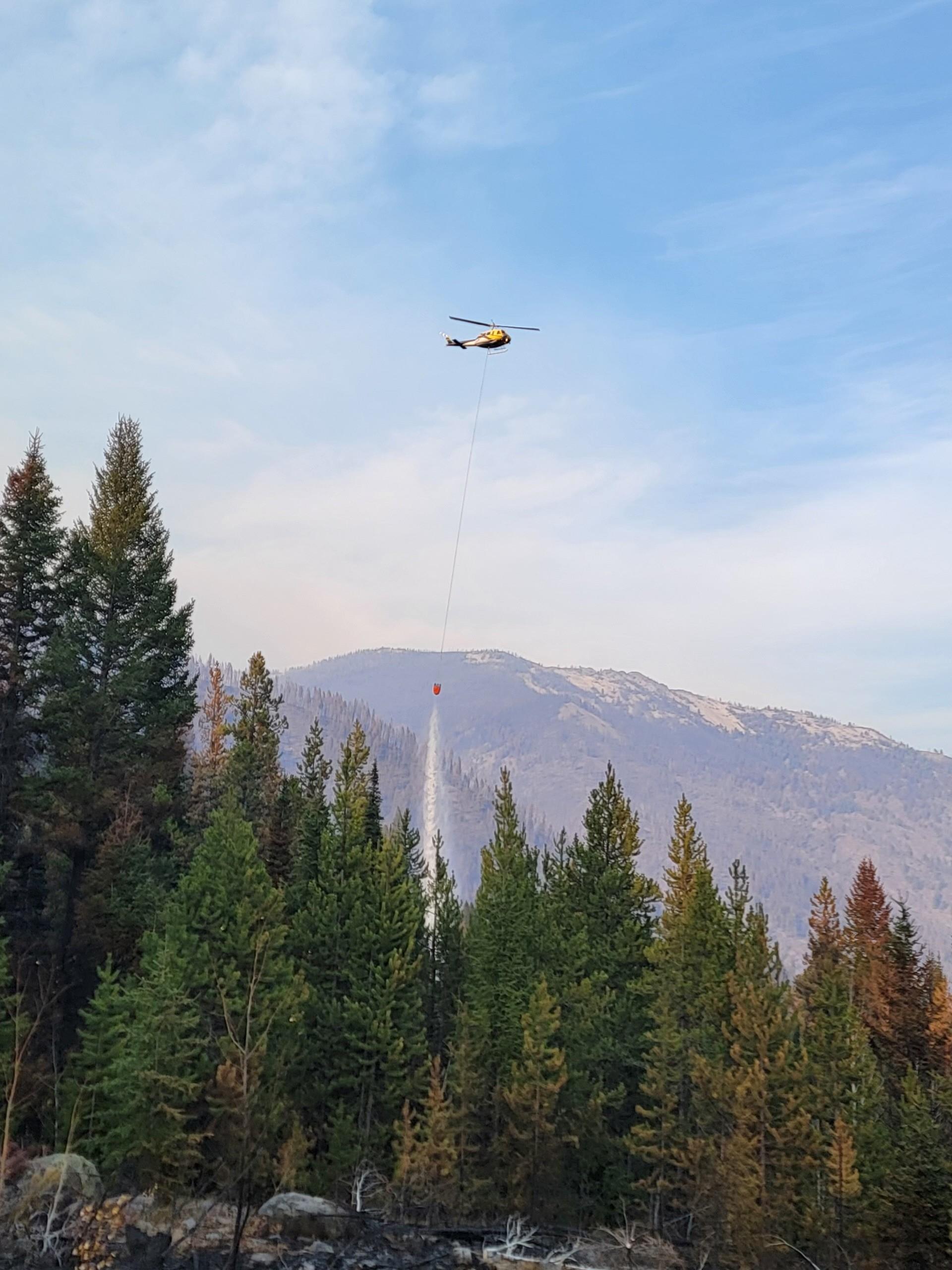 Bucket work being conducted at the north end of the air strip near Big Creek.