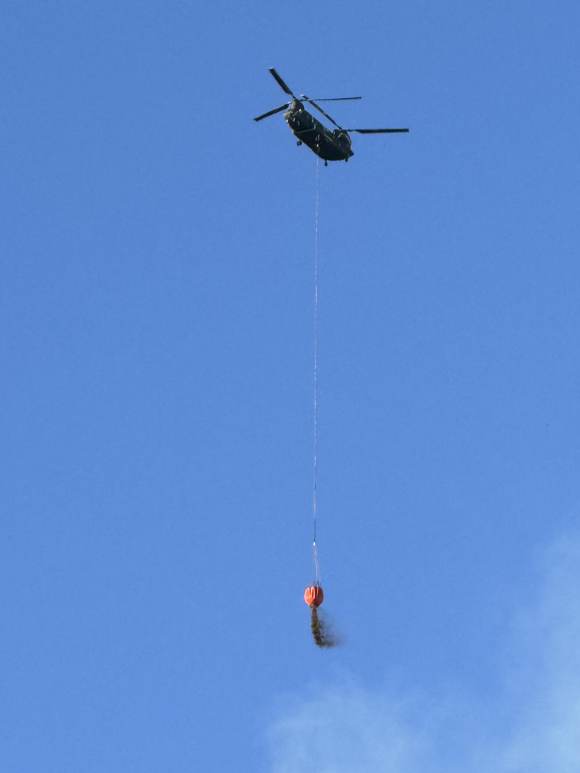 helicopter dropping water on daly fire 