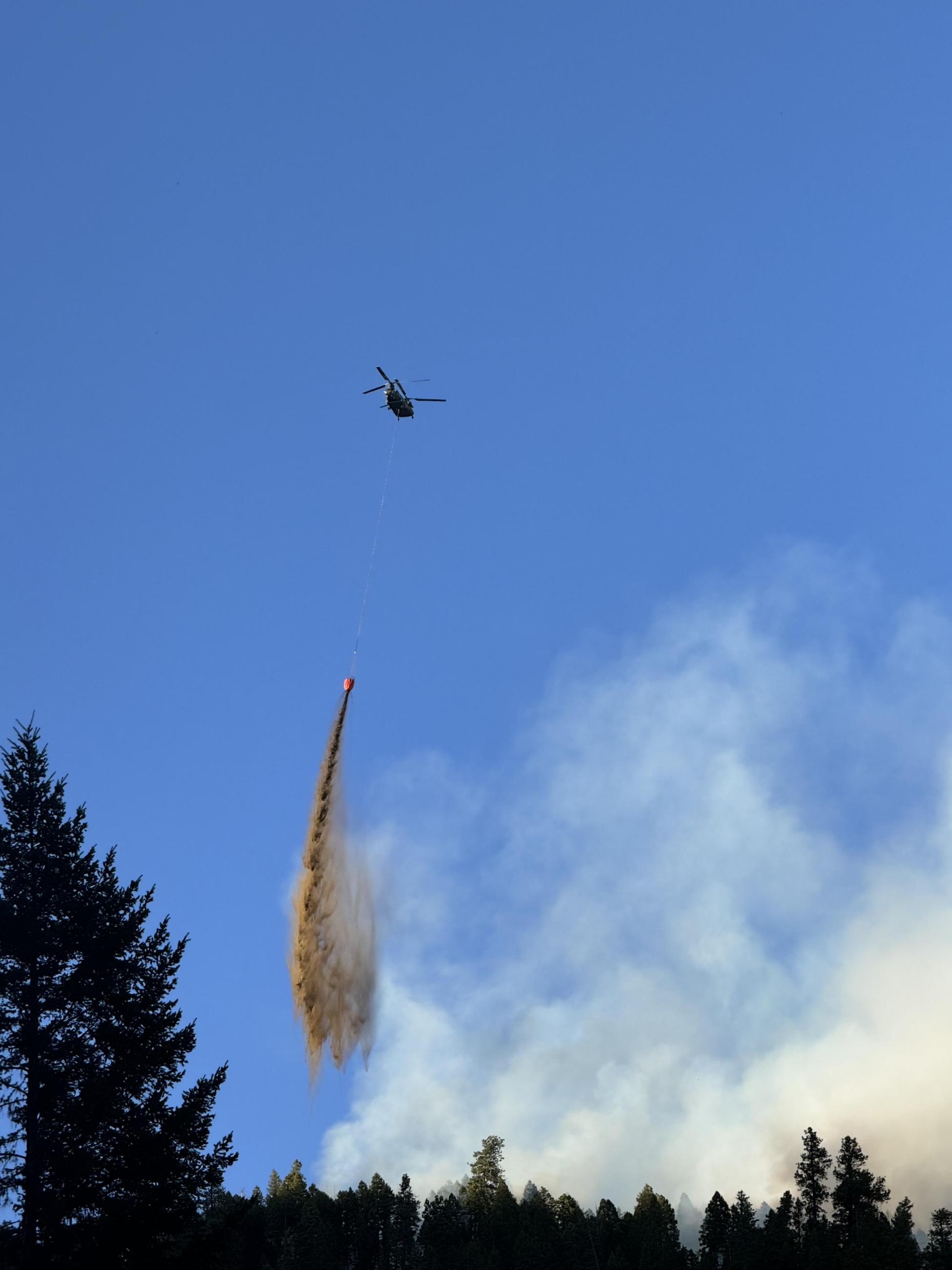 helicopter dropping buckets of water