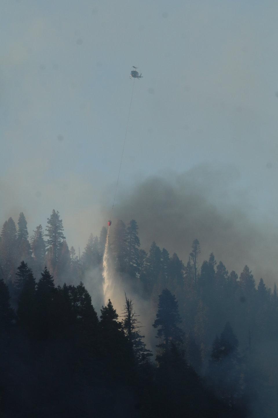 Helicopter Drops Water on Hot Spot on Northern Flank