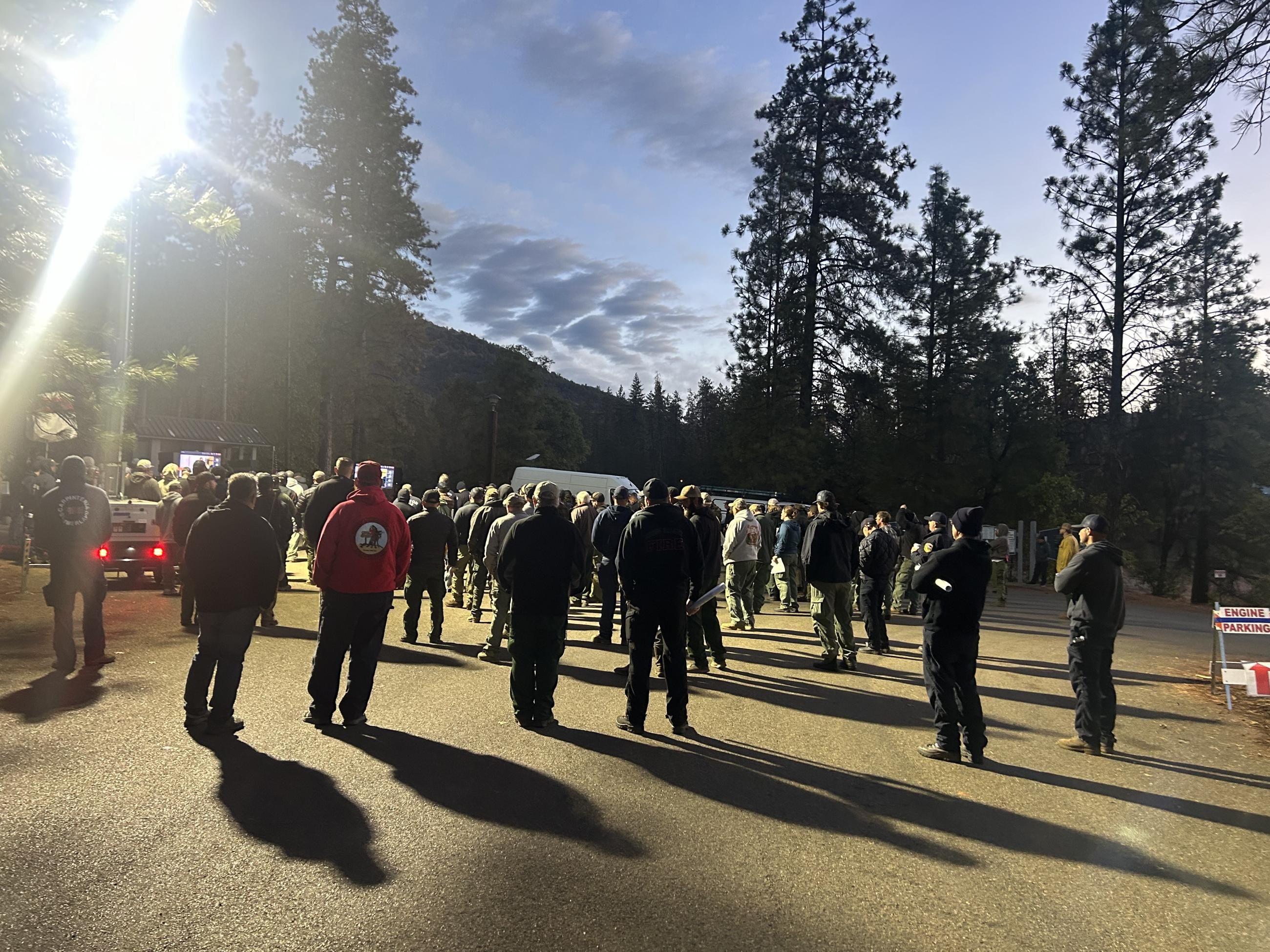 Firefighters gather for the morning briefing on the Shoe Fire.