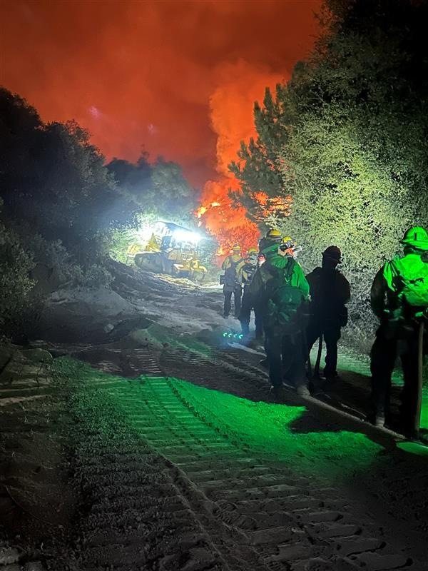 Line Fire Night Operations September 30, 2024. Showing dozer in background with firefighters approaching 