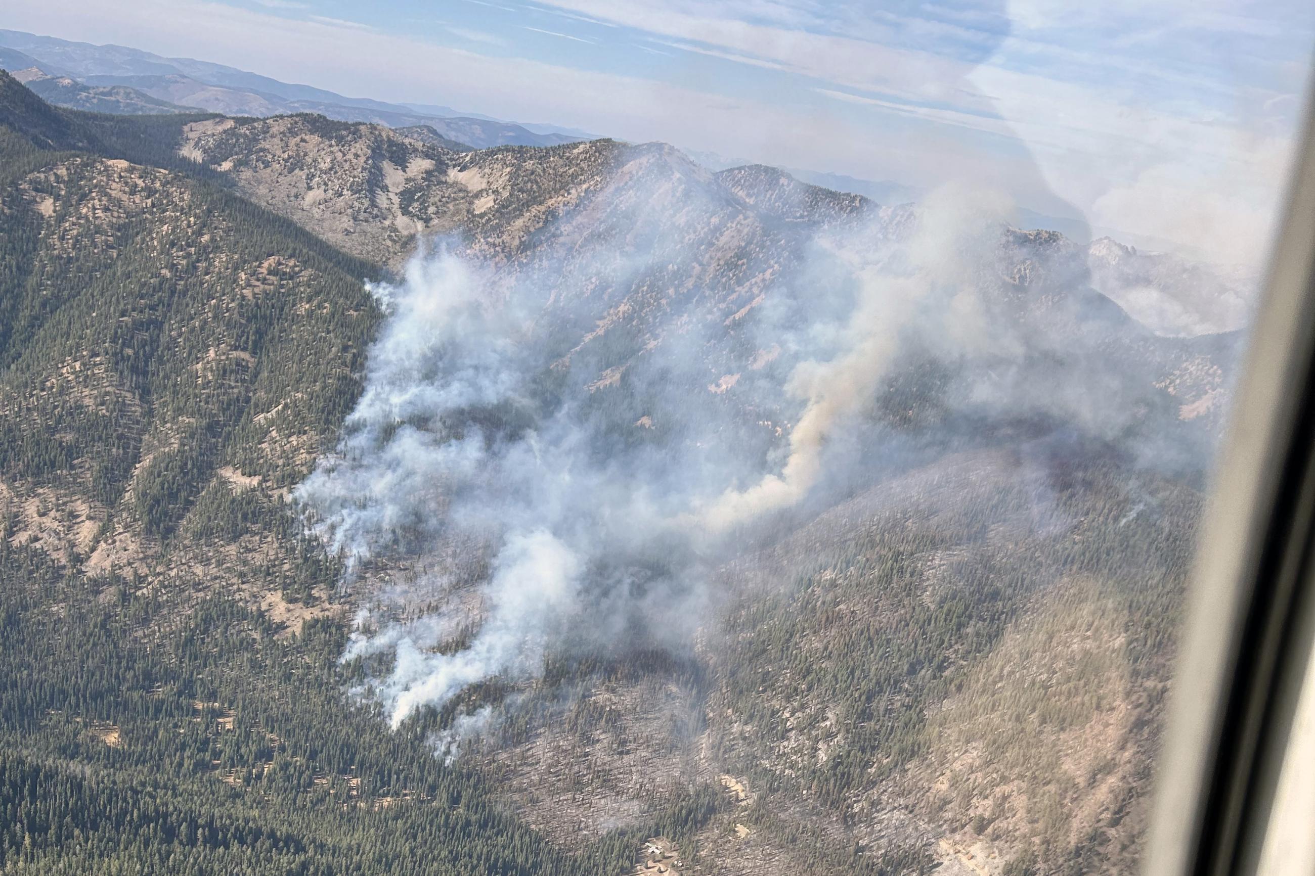 Photo shows the Logan Fire burning in Logan Creek.