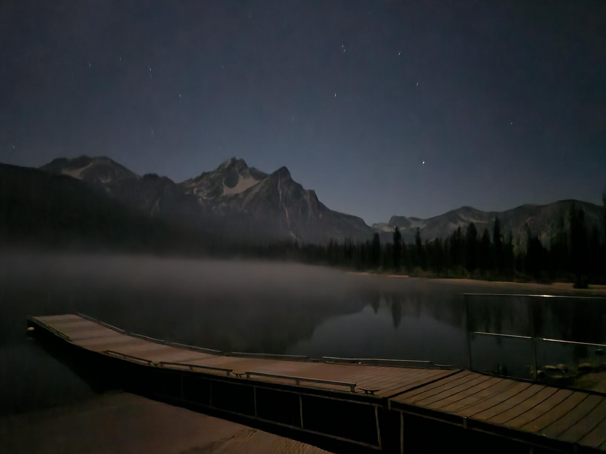 evening photo with a lake and stars