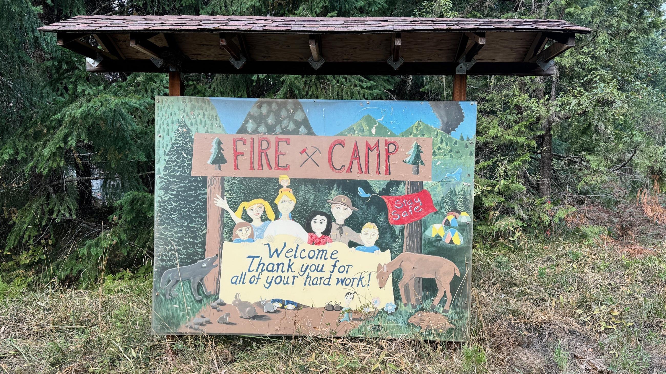 Photo of a handmade Thank You Firefighters sign with people drawn on it