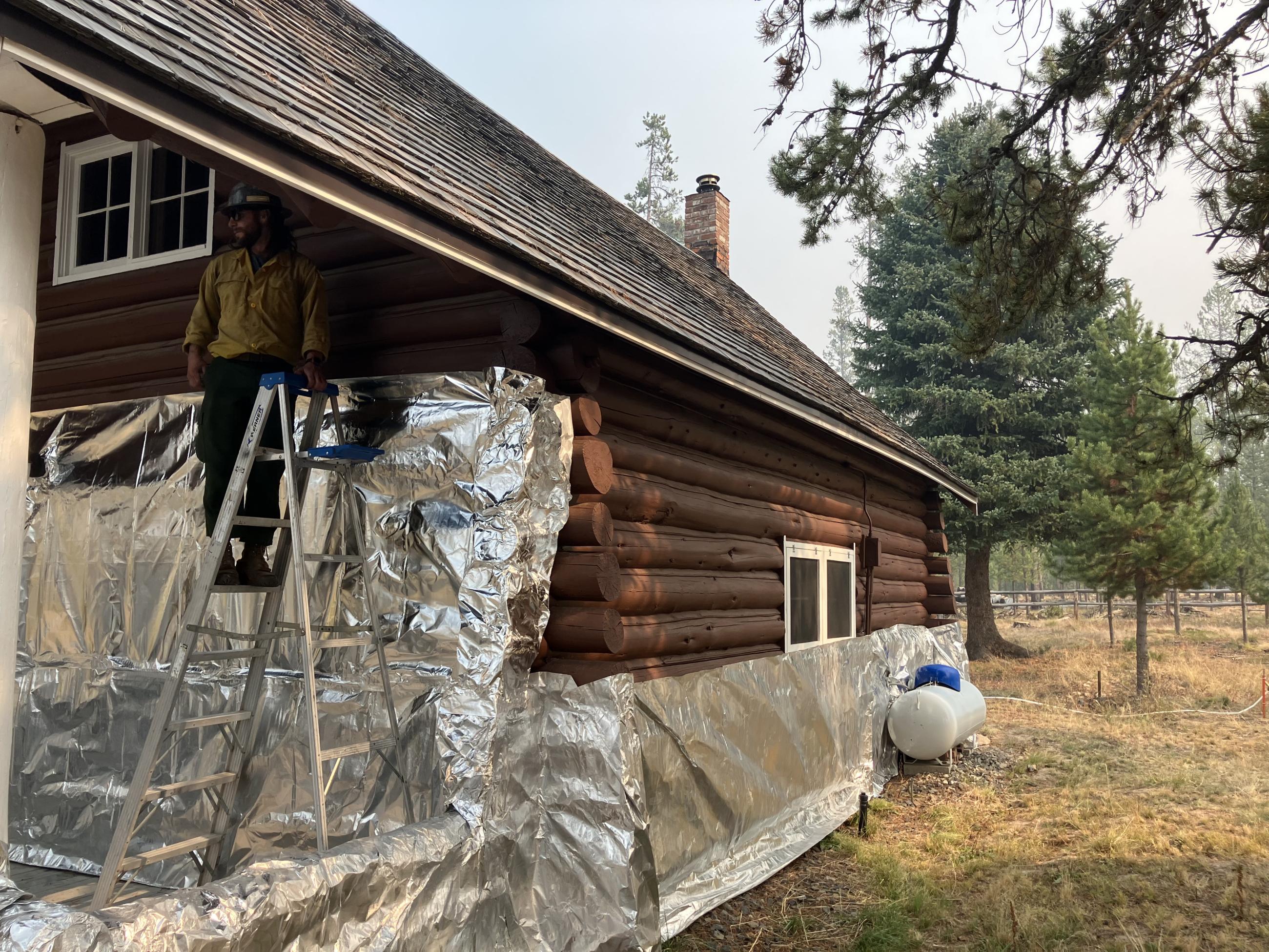 Image showing Stolle Meadows Structure Getting Wrapped for Fire Suppression Protection