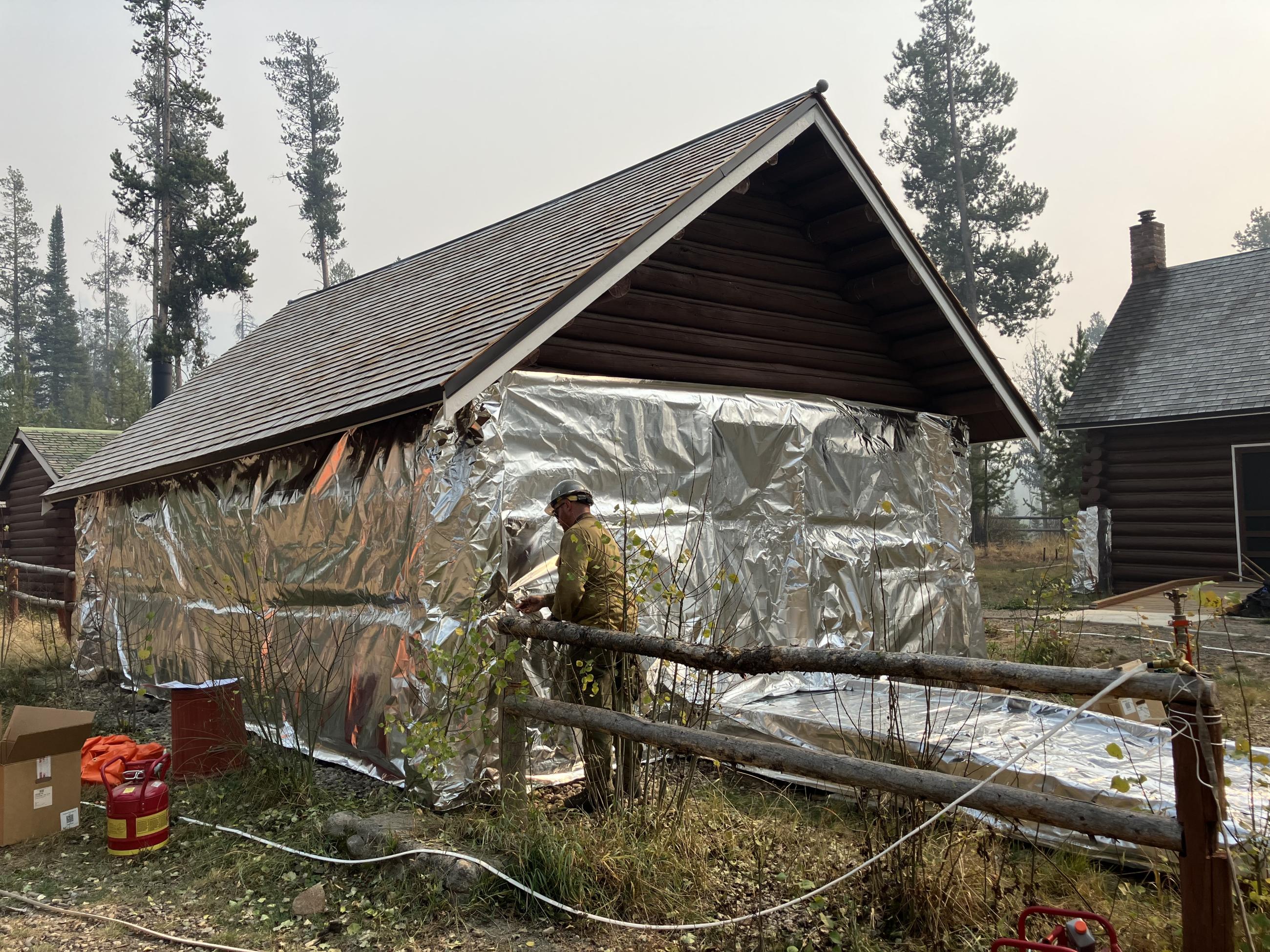 Image showing Stolle Meadows Structure Getting Wrapped for Fire Suppression Protection