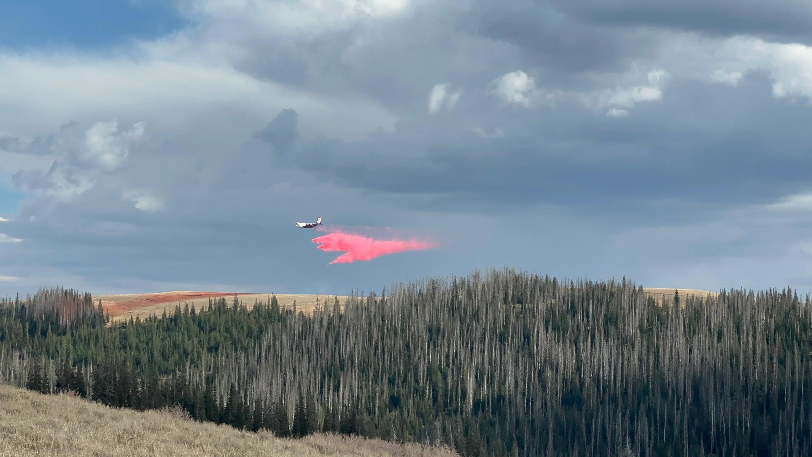 An airtanker drops retardant on the Yellow Lake Fire