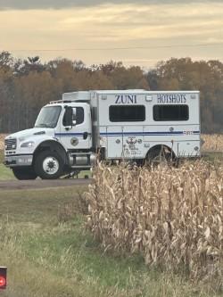 A fire vehicle in a field 