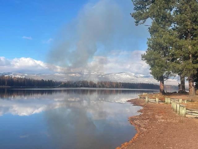 light smoke over the lake from a pile burn