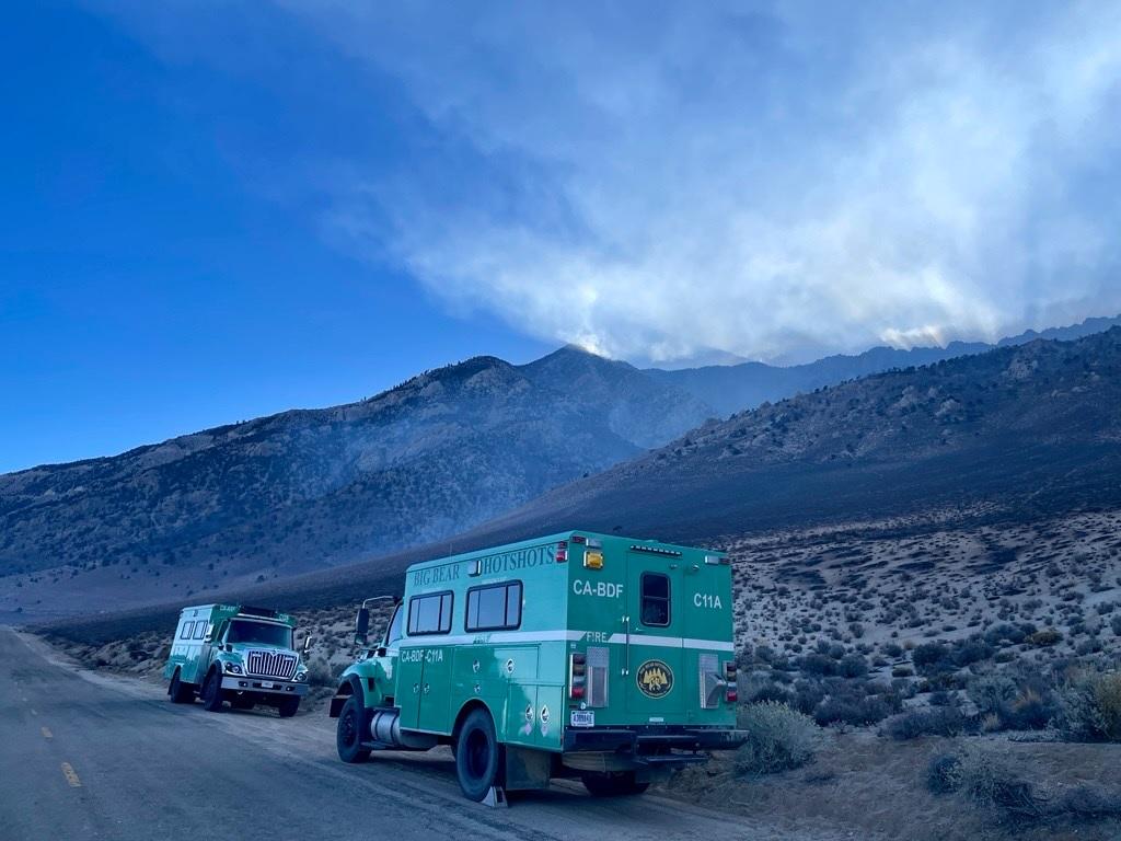 fire truck, smoke, sky, charred landscape