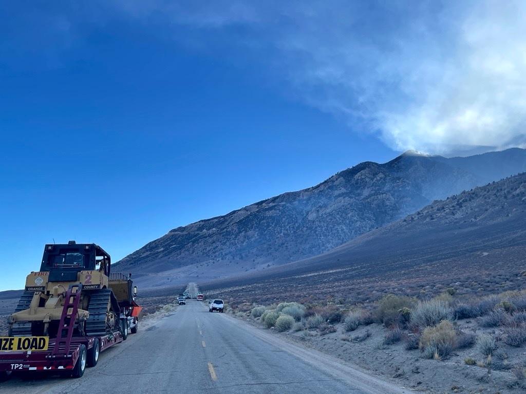 bulldozer, road, sky, smoke, charred landscape