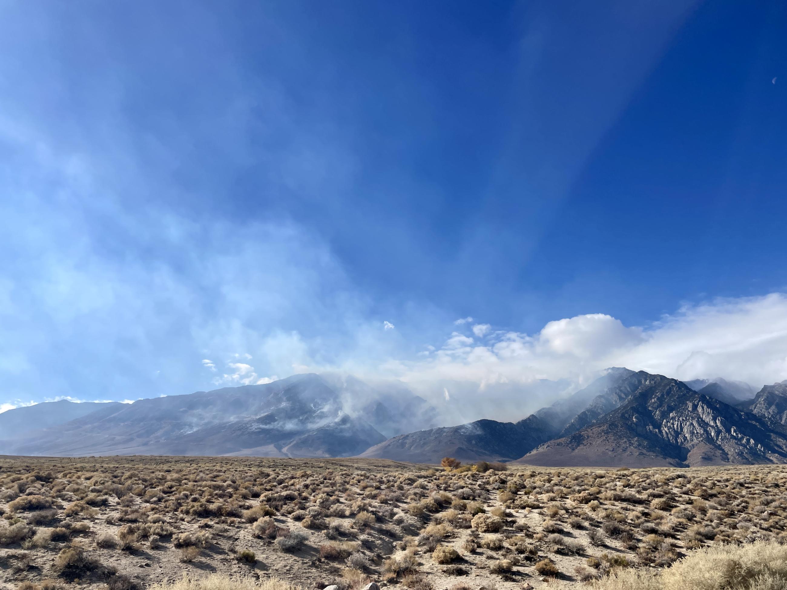 sky, mountains, sage brush, smoke from wildfire