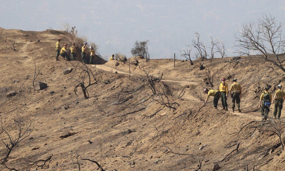 Showing the Alberta crew scouting within burn scar of the Eaton Fire