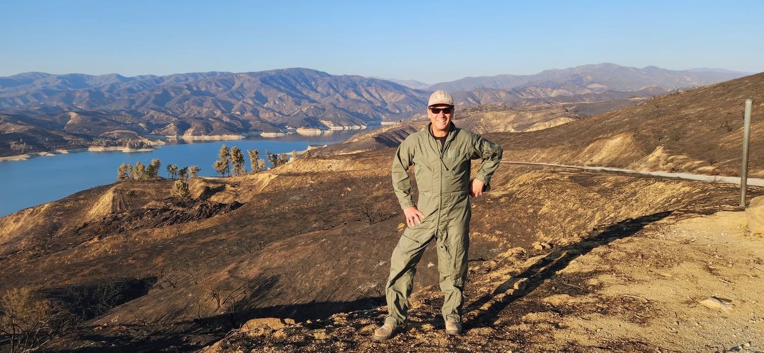 Color Photo Image showing BAER Geologist Yonni Schwartz Before Assessing the Hughes Burn Area by Aerial Reconnaissance