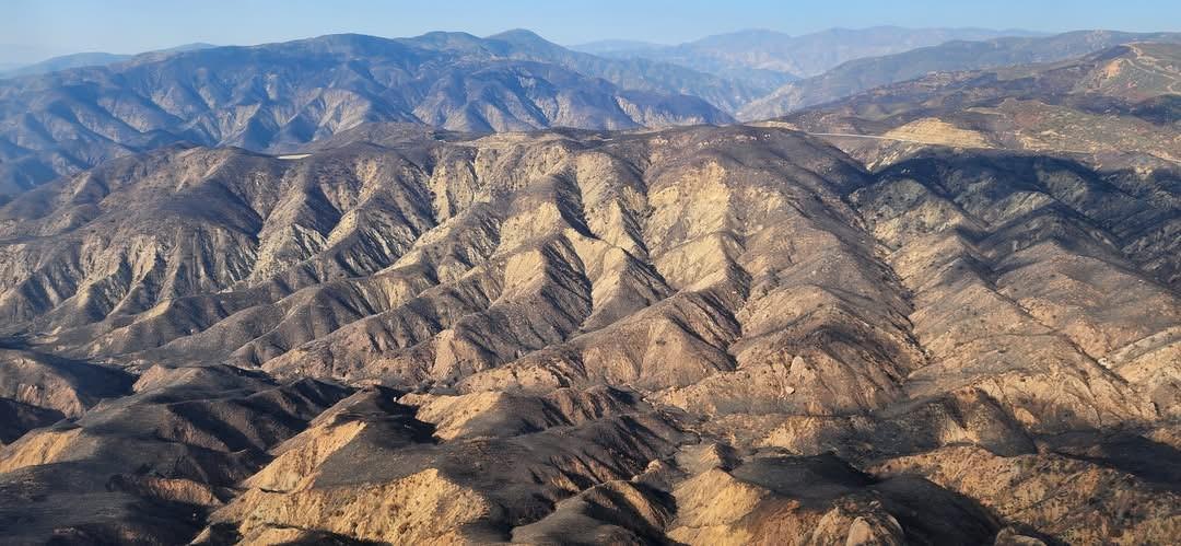 Photo Showing BAER Specialists Assess Hughes Burn Area by Aerial Reconnaissance