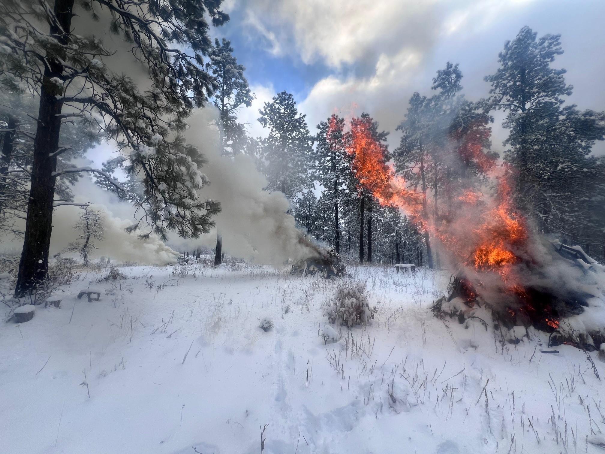 Piles burning in snow