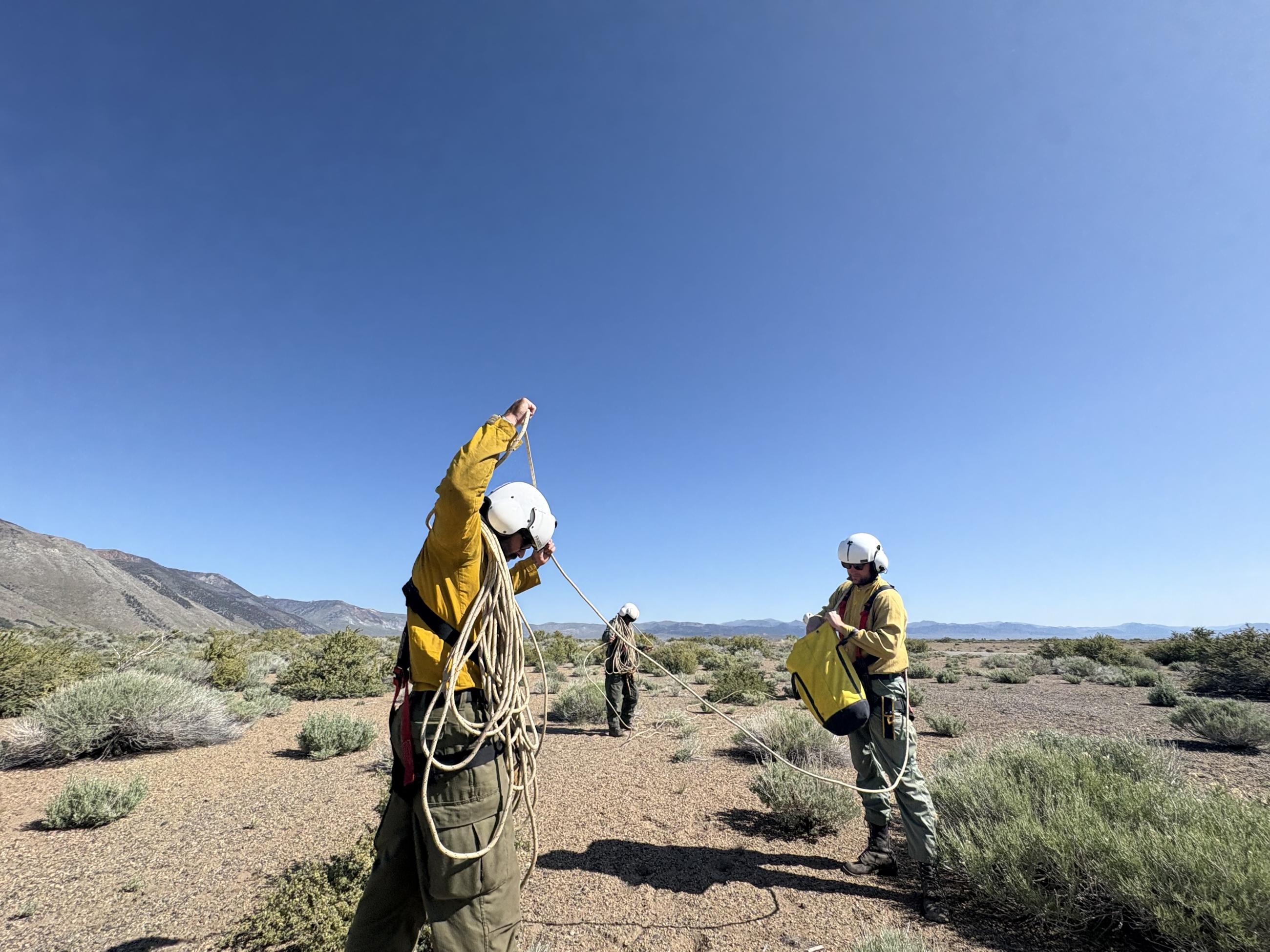 Heli Rappelers coiling ropes on the Inn Fire 5-28