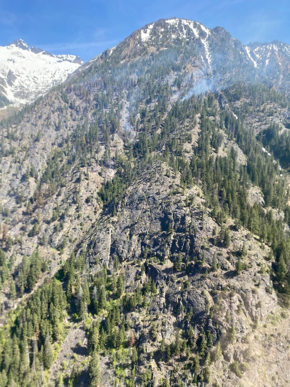 smoke coming off of top third of slope