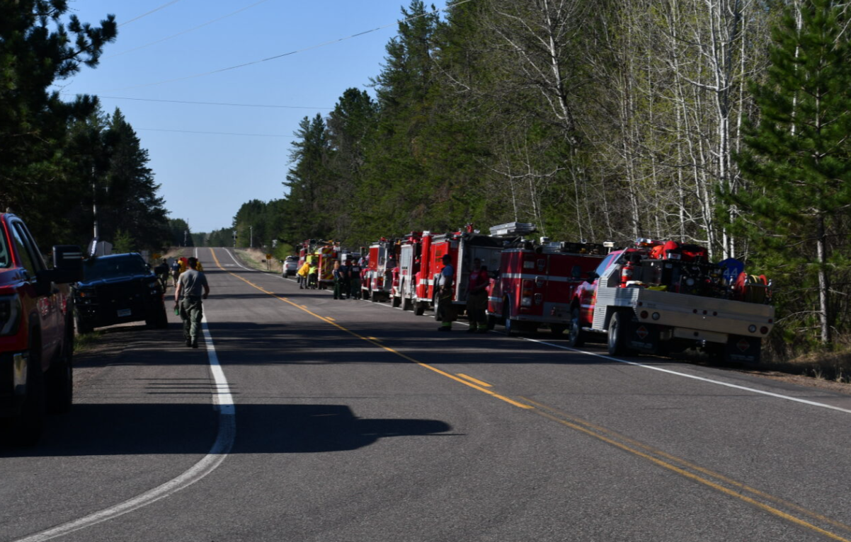 Fire trucks along a county highway in northern Minnesota