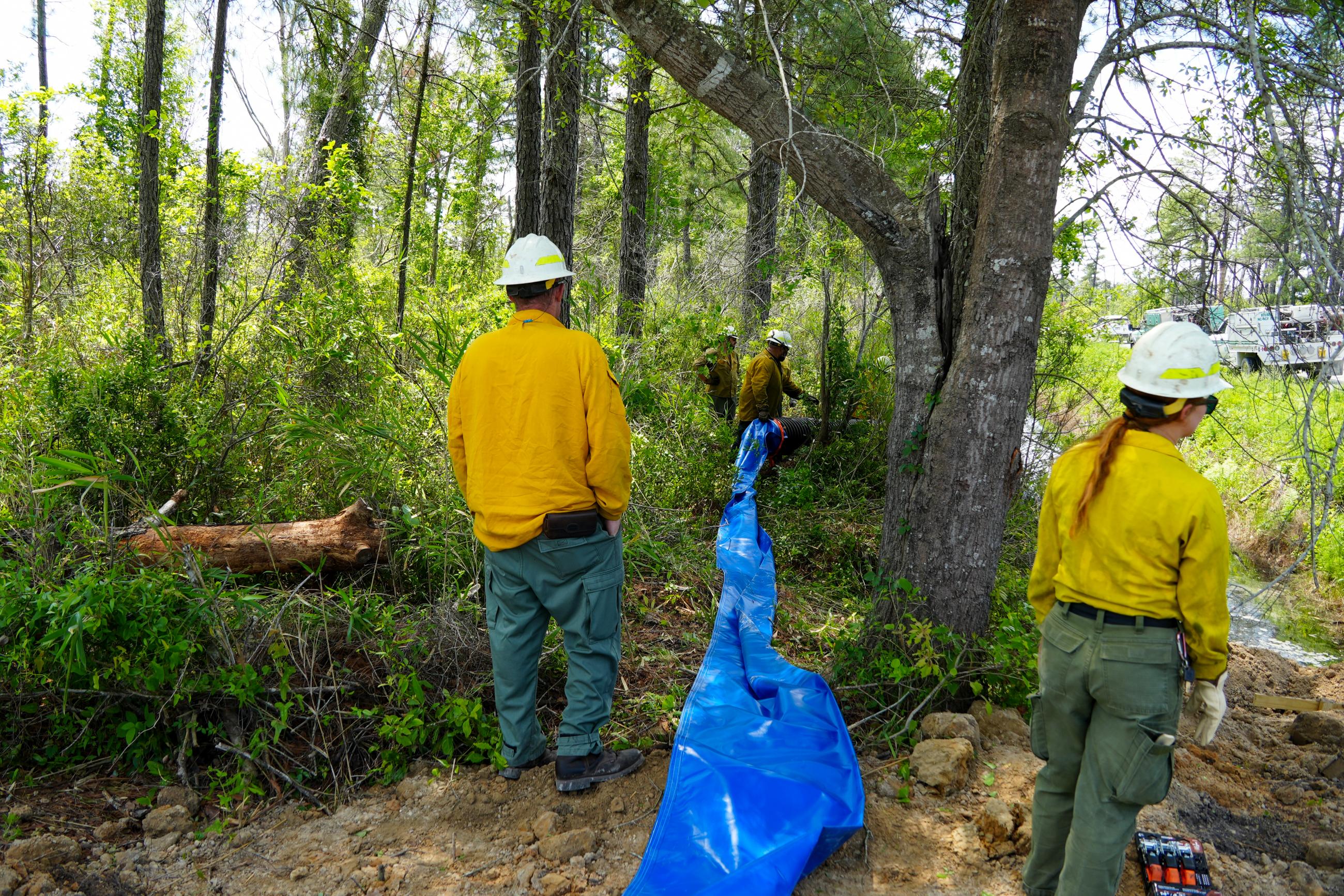 Firefighters create path for water to pass between ditches