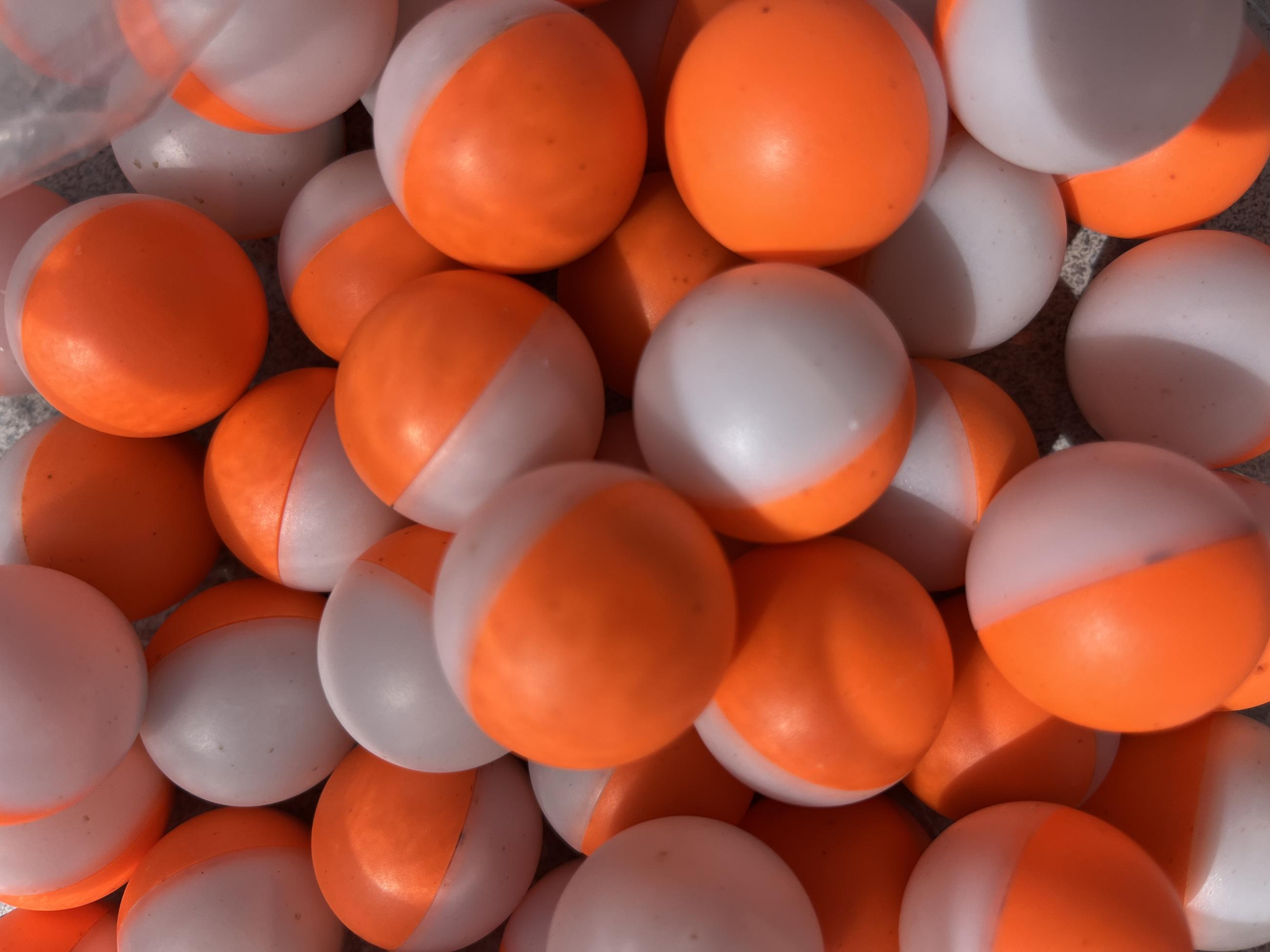 Orange and white balls utilized by UAS for aerial ignition