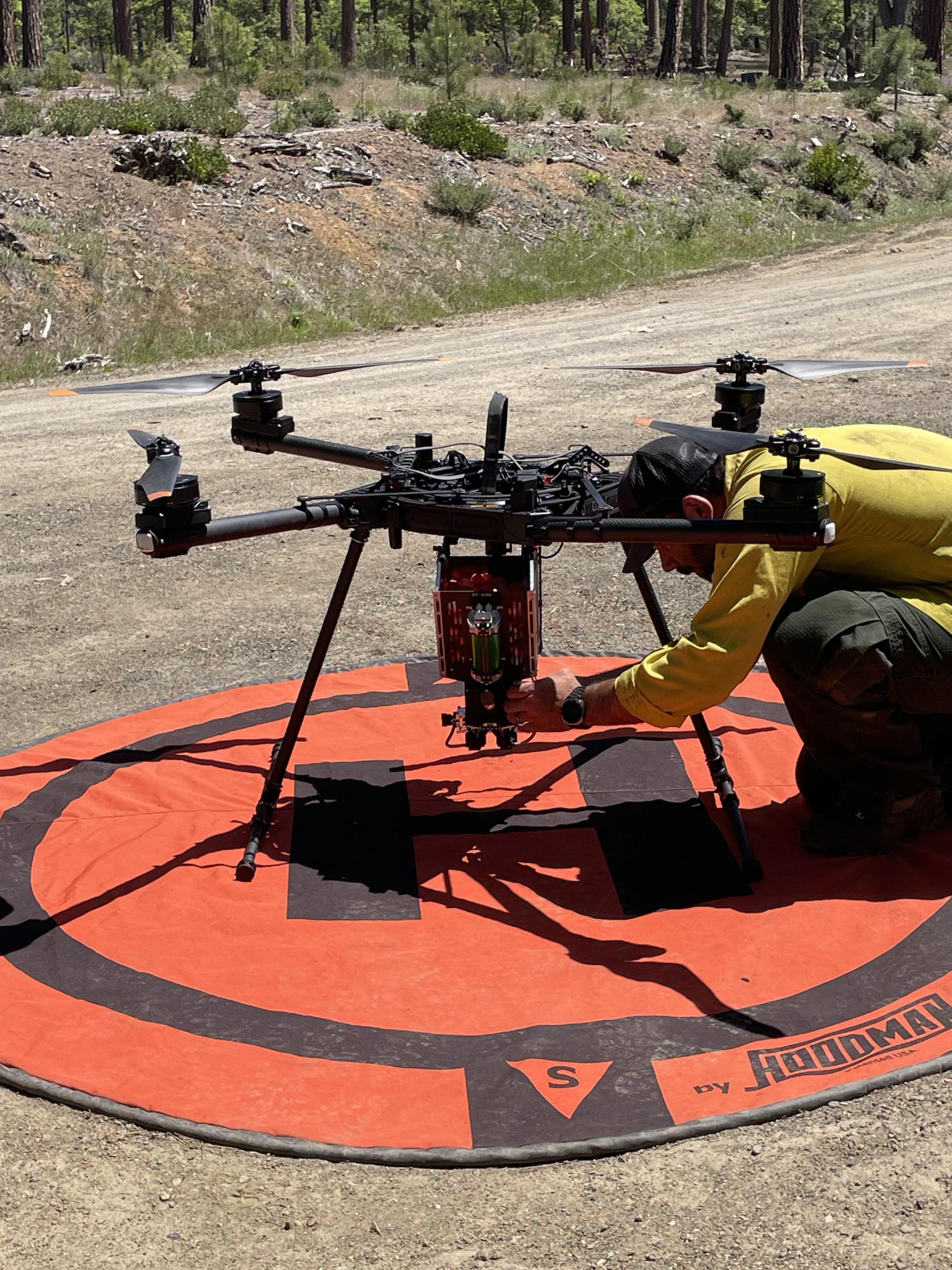 A drone pilot prepares the apparatus to launch during the Masterson Prescribed Burn